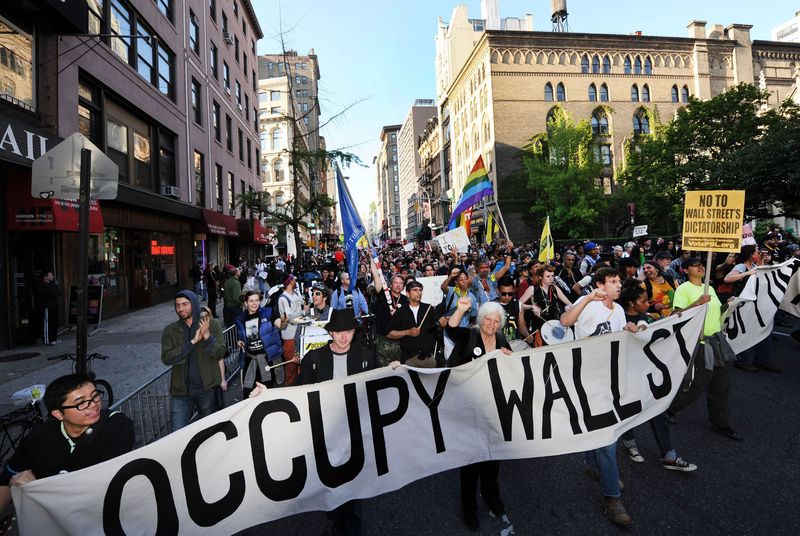 Occupy Wall Street demonstrators march down Broadway toward Lower Manhattan in 2012.