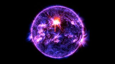 this ulraviolet image of the Sun show a very active sun with arcs of lights across its surface and a very bright overexposed post near the middle where the flare was released.
