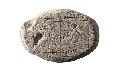 he possible gameboard with pencil marks highlighting the incised lines.