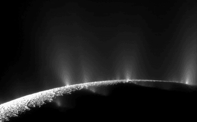 multiple geysers are backlit in this image. just a crescent of the moon is visible.