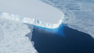 Thwaites Glacier in West Antarctica, a large body of ice surrounded by blue water.
