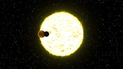 artist impression of two planets about to align in front of a star.