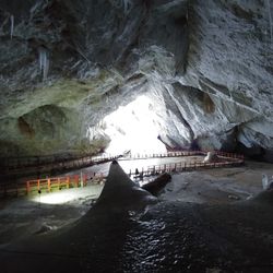 A shot from the inside of Scarisoara Ice Cave in Romania, facing towards the cave mouth.