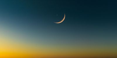 This is how the Moon and Mercury might look if the Moon's nightside was transparent and you could see Mercury through it.
