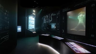a mammoth skull in a glass display of a futuristic looking room