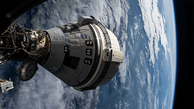 Starliner docked with the ISS on July 3, 2024, seen through a window on SpaceX's Dragon Endeavour.