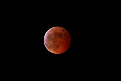 A total lunar eclipse appearing red due to Earth's shadow 