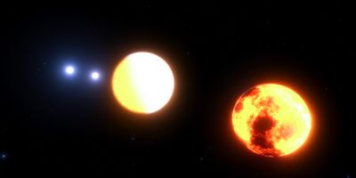 an artist impression of four stars orbiting each other two up close and two in the distance.