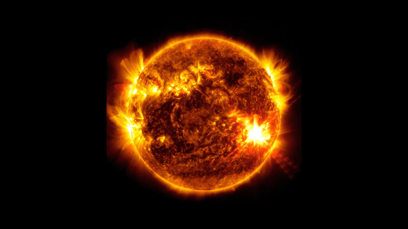 the sun in ultraviolet being very active including a silar flare that shines extremely bright on its surface