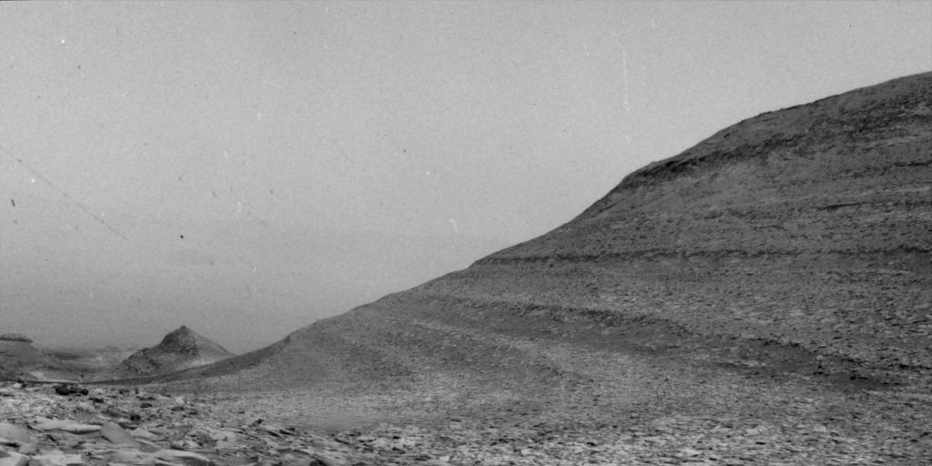 The same image of a martian hill side darmatically changing with specks of white na dblack caused by solar storms particles