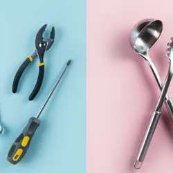 representation of traditional gender roles; left panel has a wrench, pliers, and screwdriver on a blue background; right panel has a ladle and spaghetti spoon on a pink background