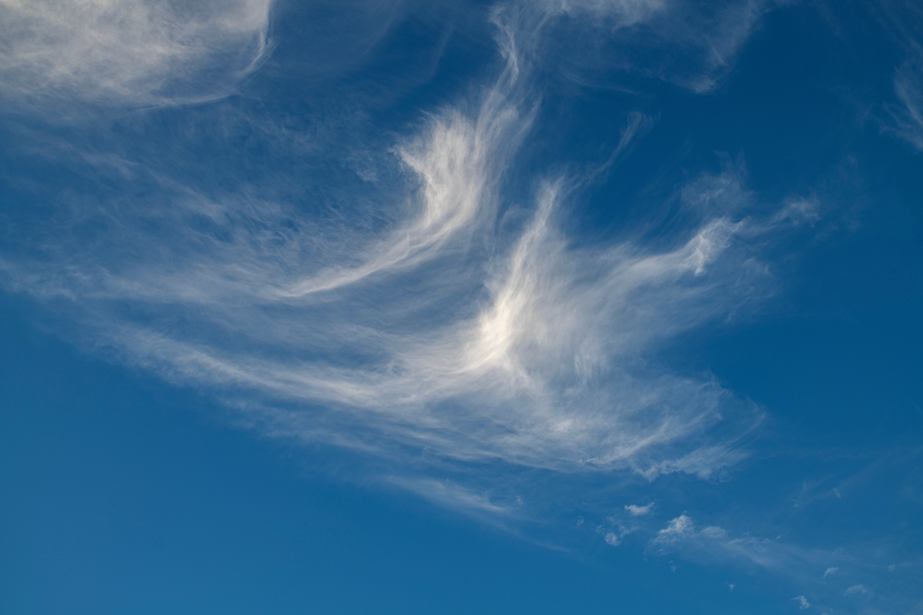 Wispy cirrus clouds are ice clouds high up in the atmosphere. 