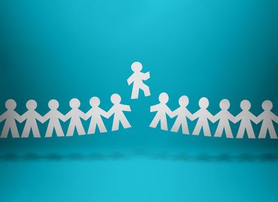 chain of paper people on a blue background with one figure in the middle breaking free from the chain and rising up