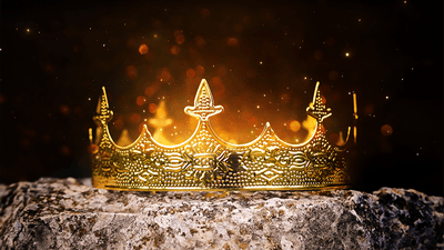 A golden crown on a rock.