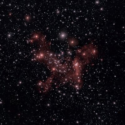 Several red stars in a group around a white cross marker that indicates where sagittarius A* is.