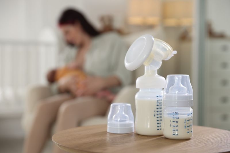 Mother and baby with expressed breast milk