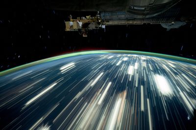 Earth's city lights streak by in this long-exposure photo taken by NASA astronaut Don Pettit onboard the ISS in October 2024.