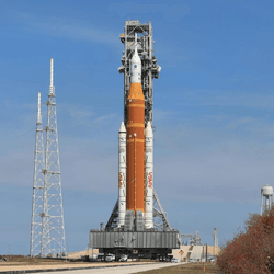 The massive rocket being transported by the crawler vehicle