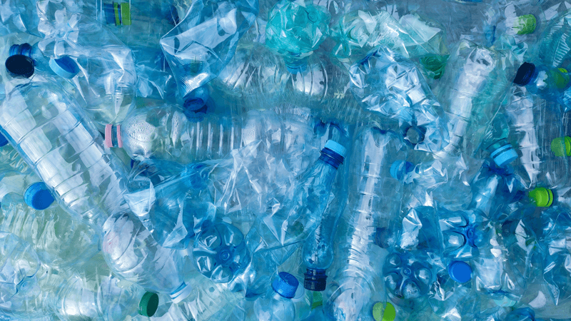 a big pile of discarded plastic bottles