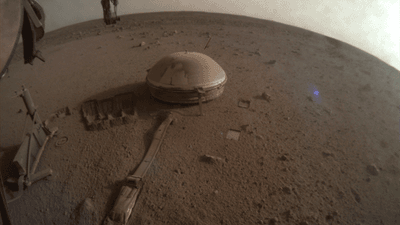 NASA's Insight Lander on Mars, covered in dust.