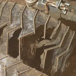 Curiosity's wheel, looking severely damaged.