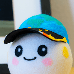 Artemis II's zero gravity indicator: A small ball plushie, with an Earth and stars hat.