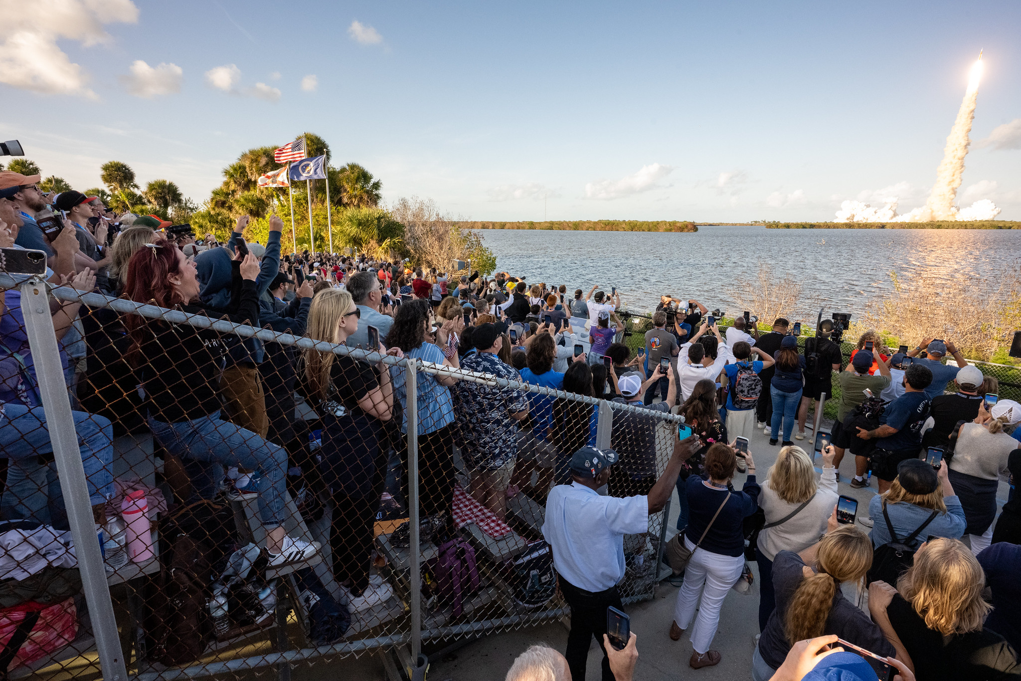Observers at the Banana Creek viewing site watch the launch of NASA’s Space Launch System (SLS) rocket and Orion spacecraft.