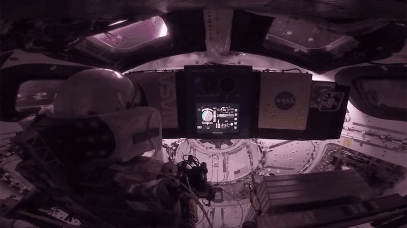 Astronaut inside the Orion capsule for the Artemis II mission.