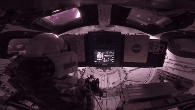 Astronaut inside the Orion capsule for the Artemis II mission.