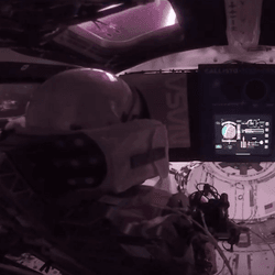 Astronaut inside the Orion capsule for the Artemis II mission.