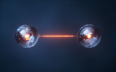 artist impression of two particles connected by a beam of light