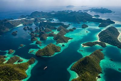aerial drone image of a remote, hilly group of tropical islands