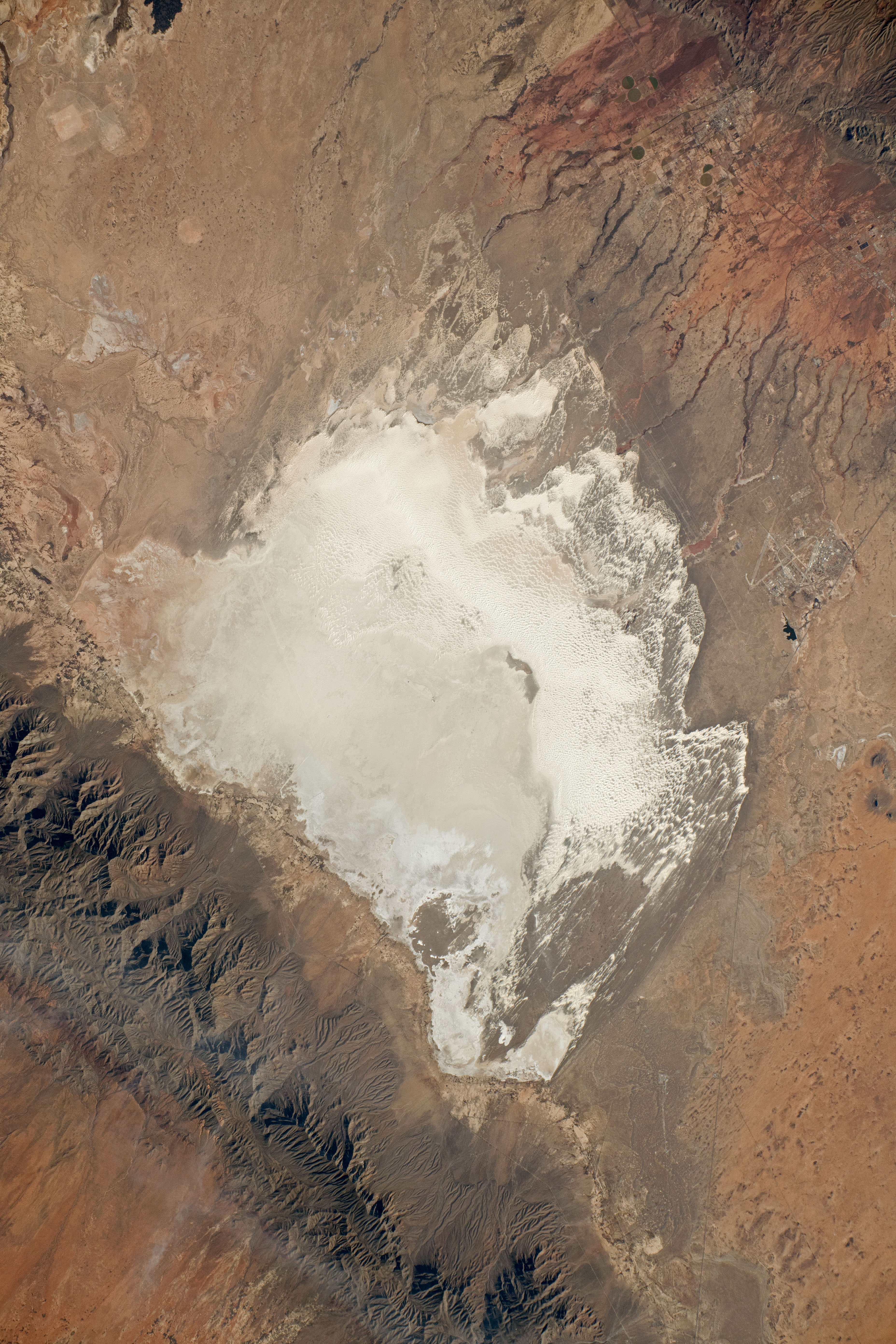 satellite image of a bright-white desert landscape satellite image of a bright-white desert landscape