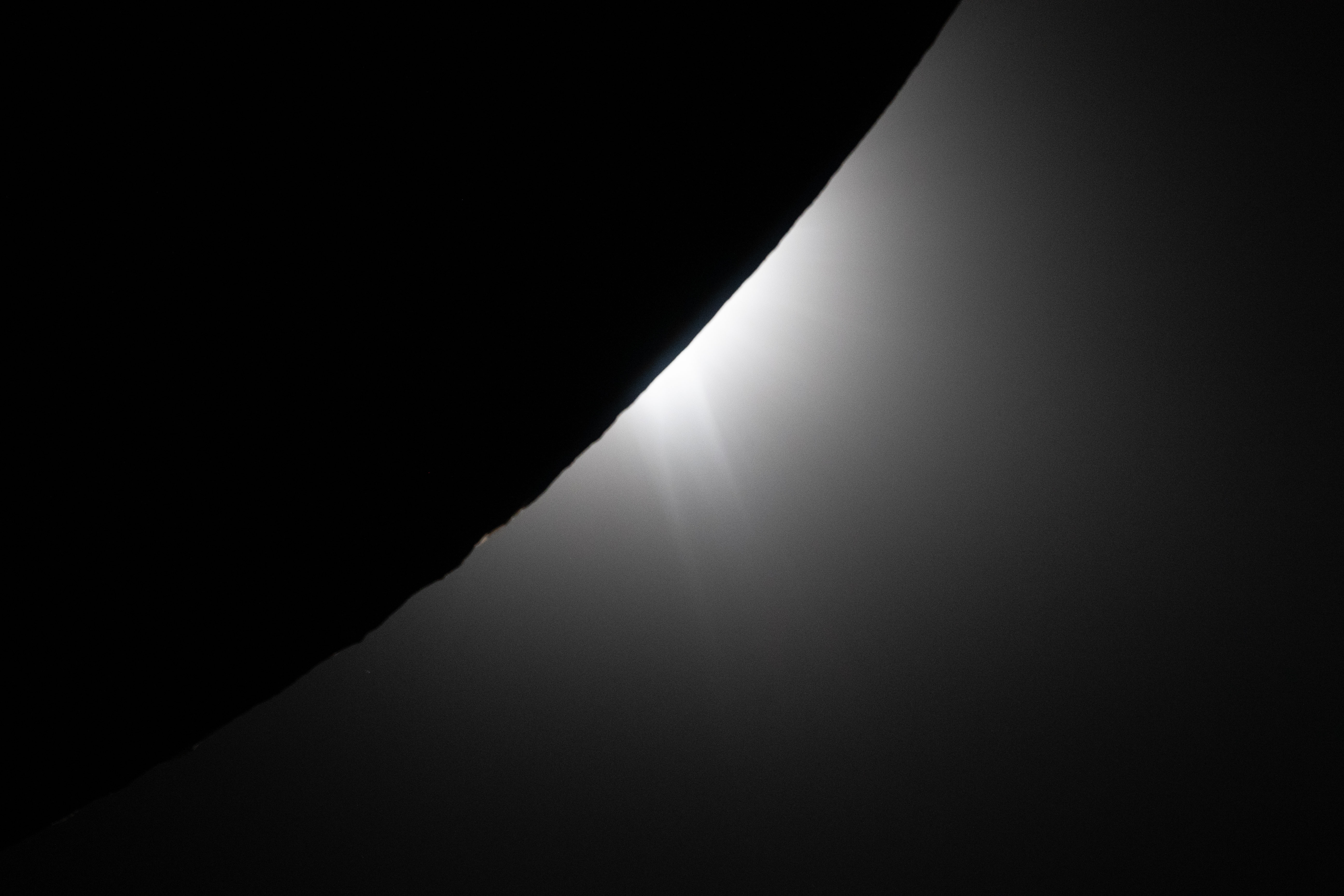 the edge of the moon is silhoutted against the light of the Sun. the edge of the moon is silhoutted against the light of the Sun.