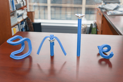 four different zipper, te first looks like a chari, then an open straight one, a close one, looking like a column, and one looking like a coil.
