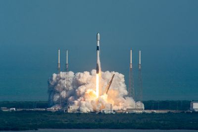 a rocket is launching generating a lot of fire and steam