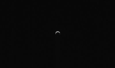 The image shows a small thin crescent: mars