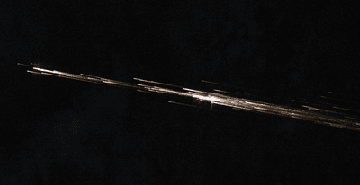 light streaks across Earth’s atmosphere in this photo captured by an astronaut aboard the International Space Station on April 27, 2026.