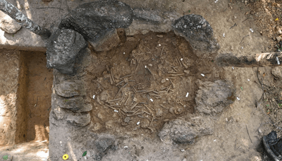 Site 75, a giant jar filled with dozens of human remains, viewed from above during excavations.