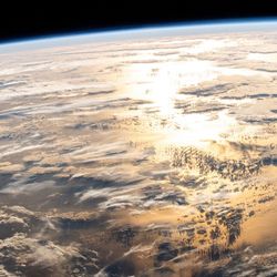 The sun rises over a cloudy Atlantic Ocean, as seen from the International Space Station on March 5, 2025. 