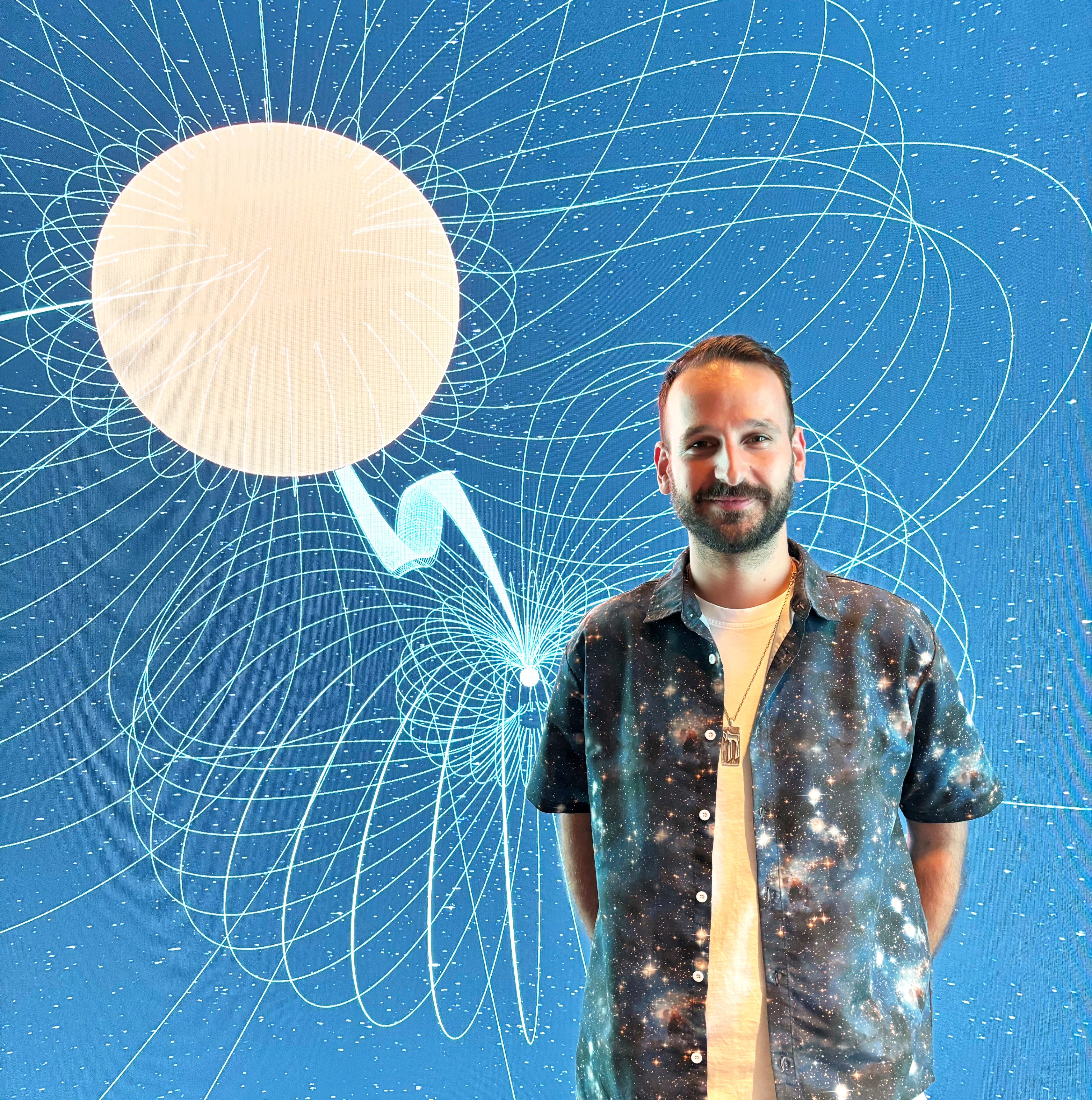 Lead author Kovi Rose from the School of Physics at the University of Sydney, stands in front of an image visualisation of the white dwarf binary ASKAP J1745-5051. Lead author Kovi Rose from the School of Physics at the University of Sydney, stands in front of an image visualisation of the white dwarf binary ASKAP J1745-5051.