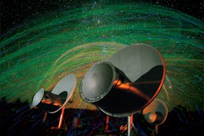 A handful of radio antennas and overlaid many colorful lines
