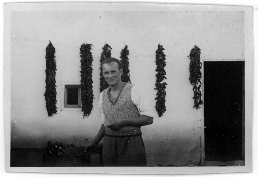 Oskar Speck in front of wall with hanging chillis