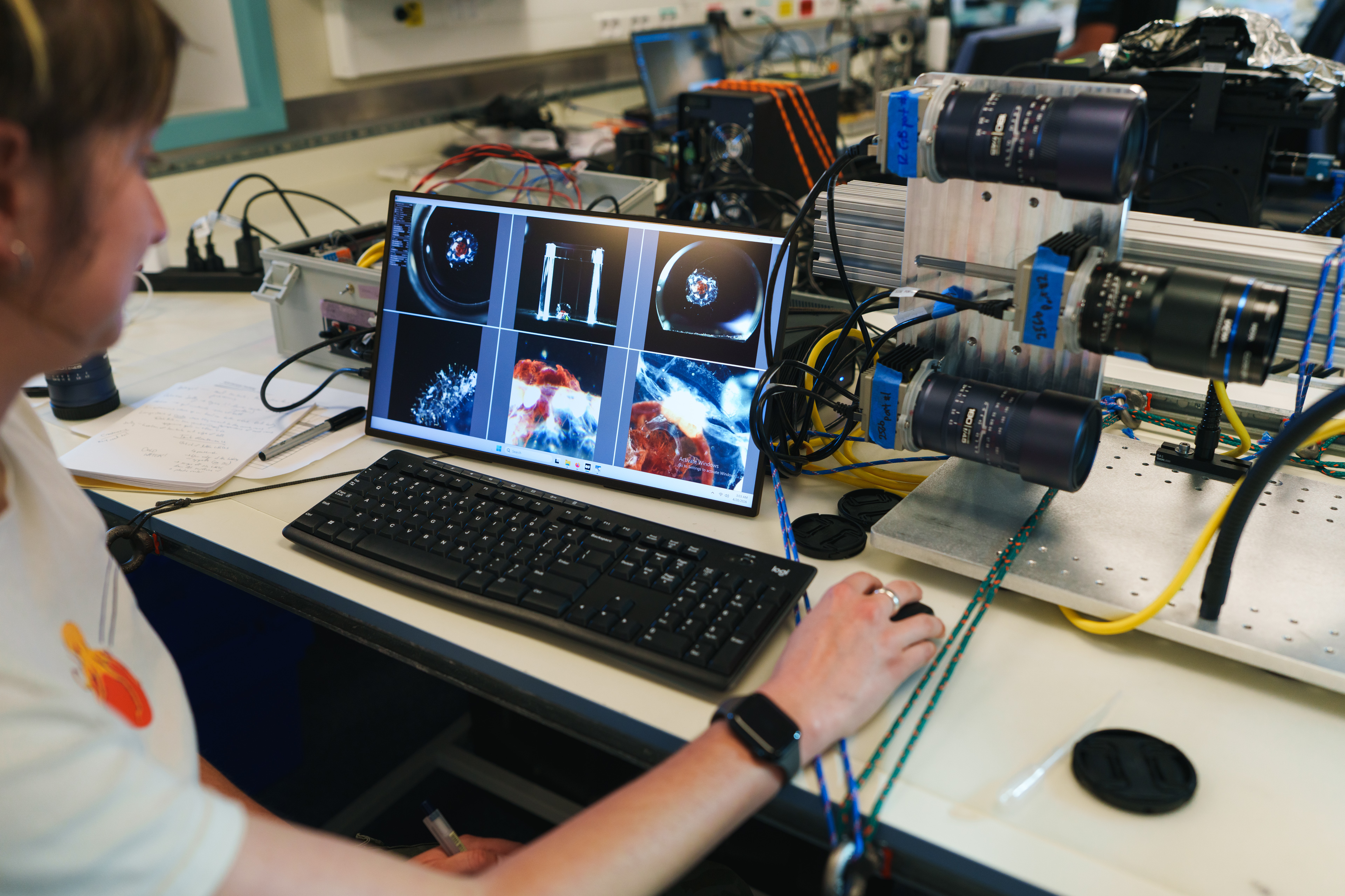 Research Engineering Technician Emily Clark (MBARI, Monterey Bay Aquarium Research Institute) uses a custom-built camera array to photograph midwater creatures Research Engineering Technician Emily Clark (MBARI, Monterey Bay Aquarium Research Institute) uses a custom-built camera array to photograph midwater creatures