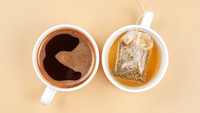 a cup of coffee on the left, a cup of tea on the right