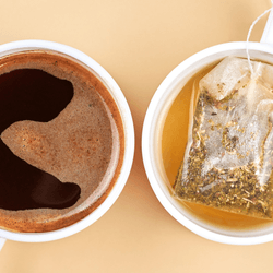 a cup of coffee on the left, a cup of tea on the right