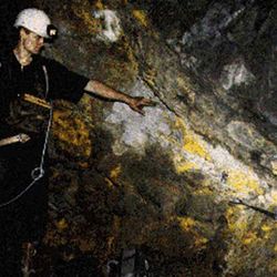 A geologist makes their way through a through the main mine in Oklo, Gabon