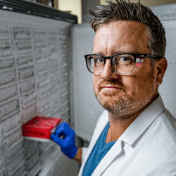 matt james stands in front of a frozen storage system containing animal cells