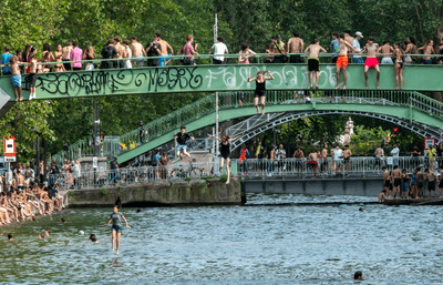 Parisians swim in the Saint Martin canal during the heatwave on June 19 2026. 