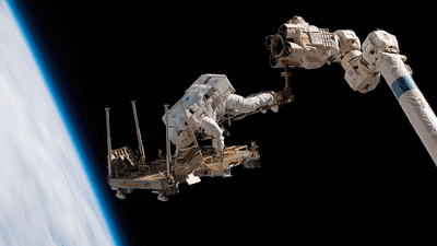 ESA astronaut Christer Fuglesang conducting a spacewalk during construction of the ISS.